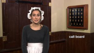 A still from one of the videos in the interactive: Bertha the maid explains the electrical call system at Lotherton Hall.