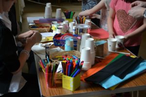 The electricity-themed arts and crafts activity - making and decorating cup and string telephones - was popular with children and adults alike!
